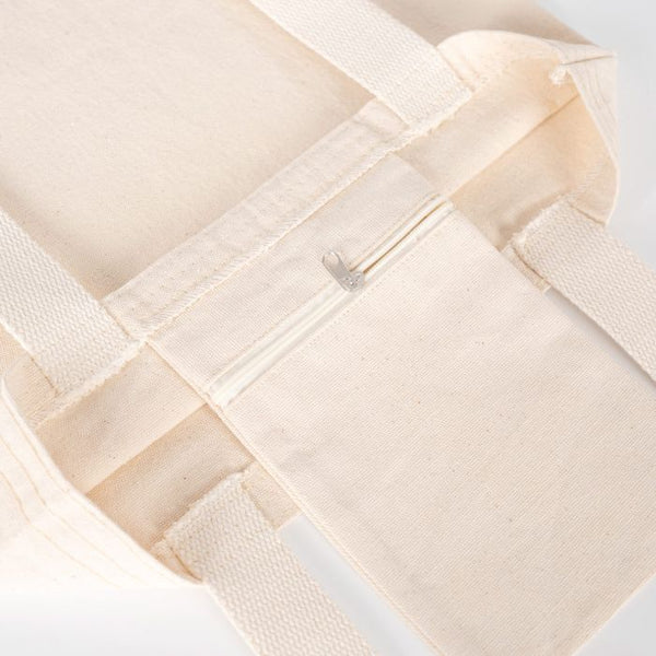 Close-up of a woven beige fabric with a white background
