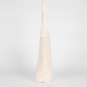 Beige tote bag on a light gray background