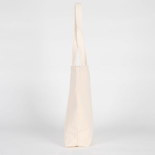 Beige tote bag on a light gray background