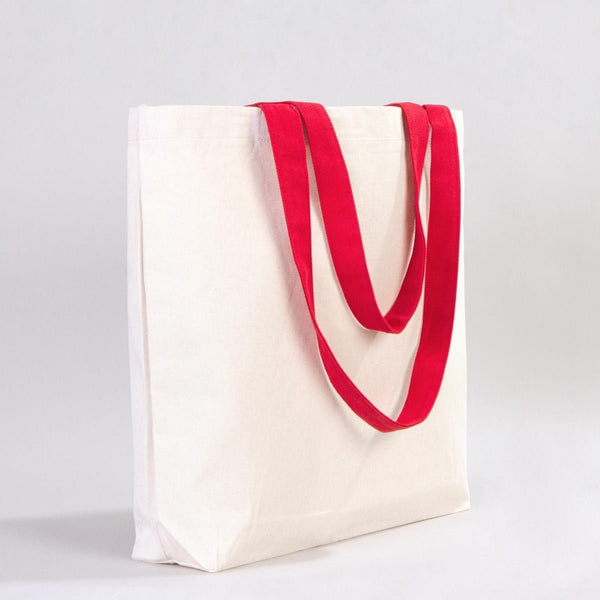 White tote bag with red handles on a light gray background