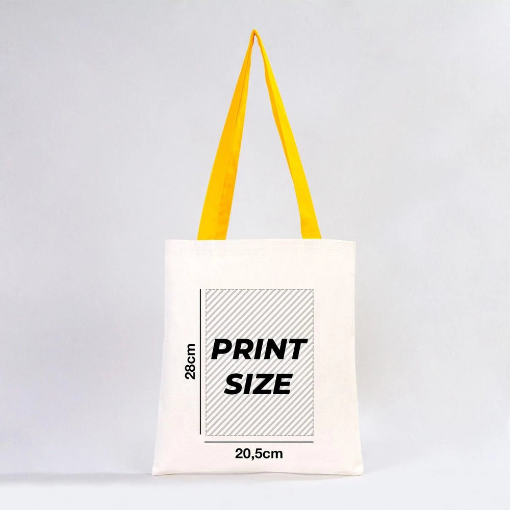 Beige tote bag with customizable text on a wooden stand