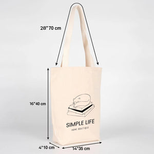 Beige tote bag with 'Simple Life' text and dimensions on a light gray background