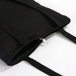 Black tote bag with a zipper on a white background