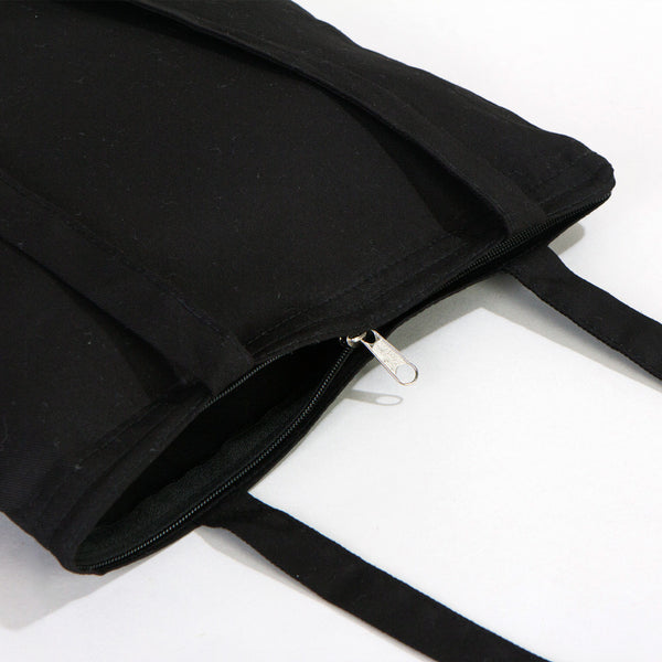 Black tote bag with a zipper on a white background